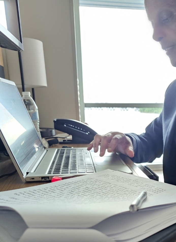 Person working on laptop at desk